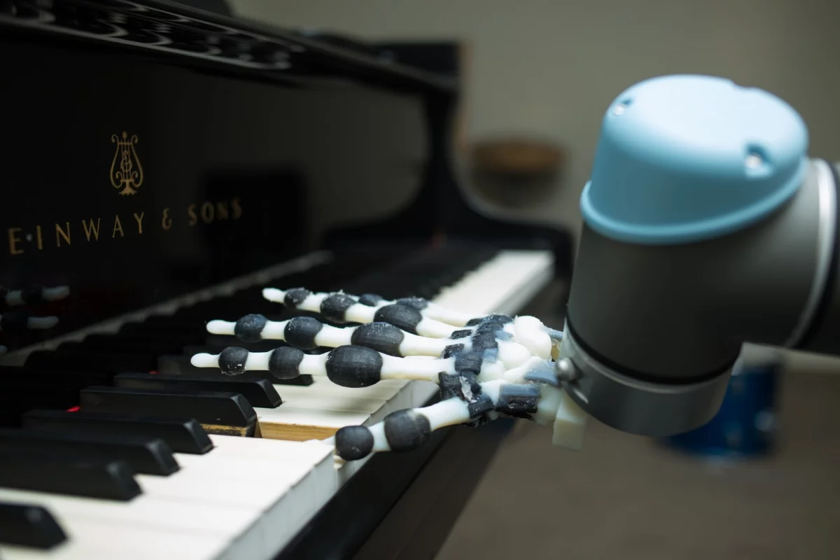 The robot hand can play simple musical phrases by rocking and rolling the wrist