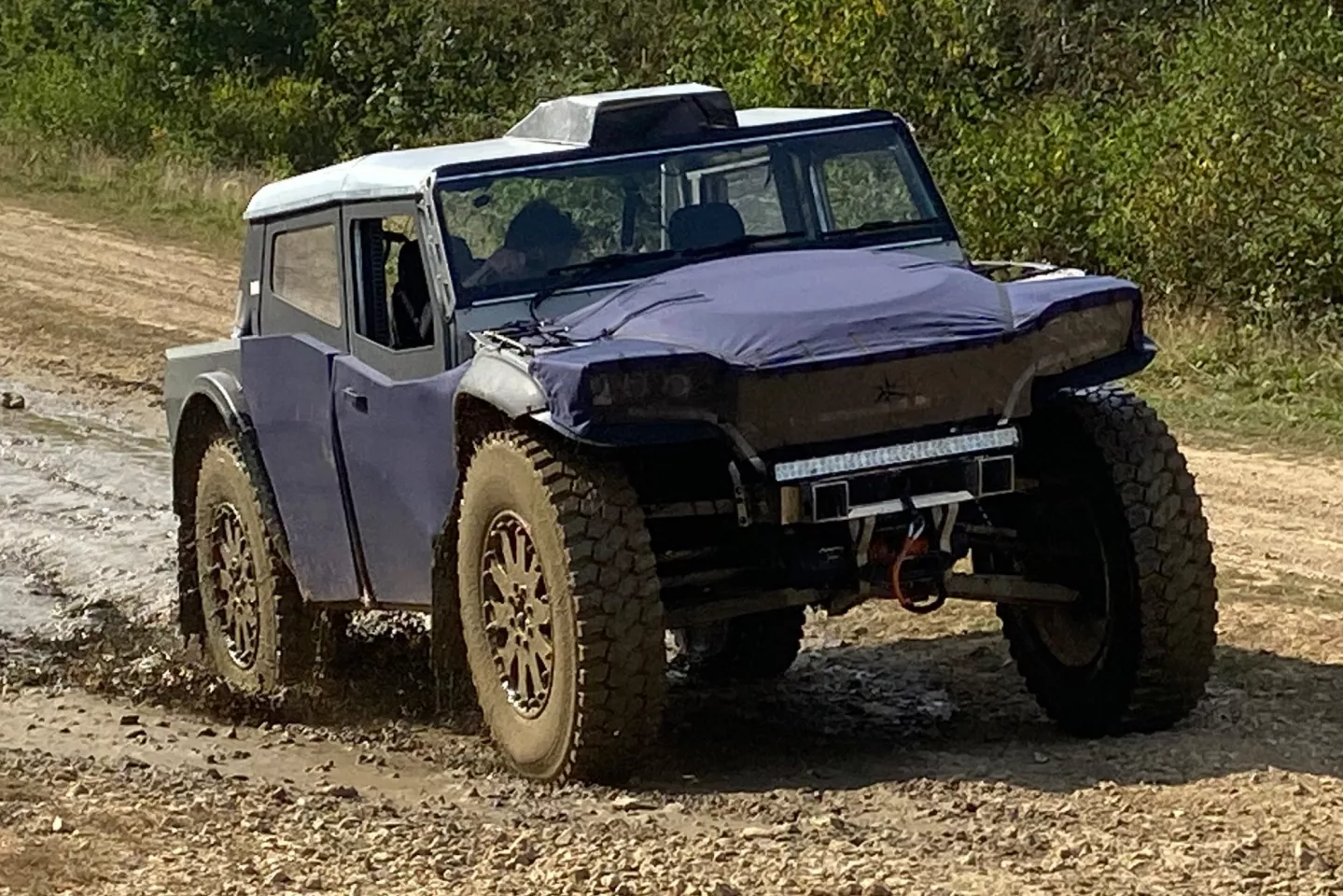 The Pioneer uses an aluminum/composite spaceframe with canvas bodywork, keeping its weight very low