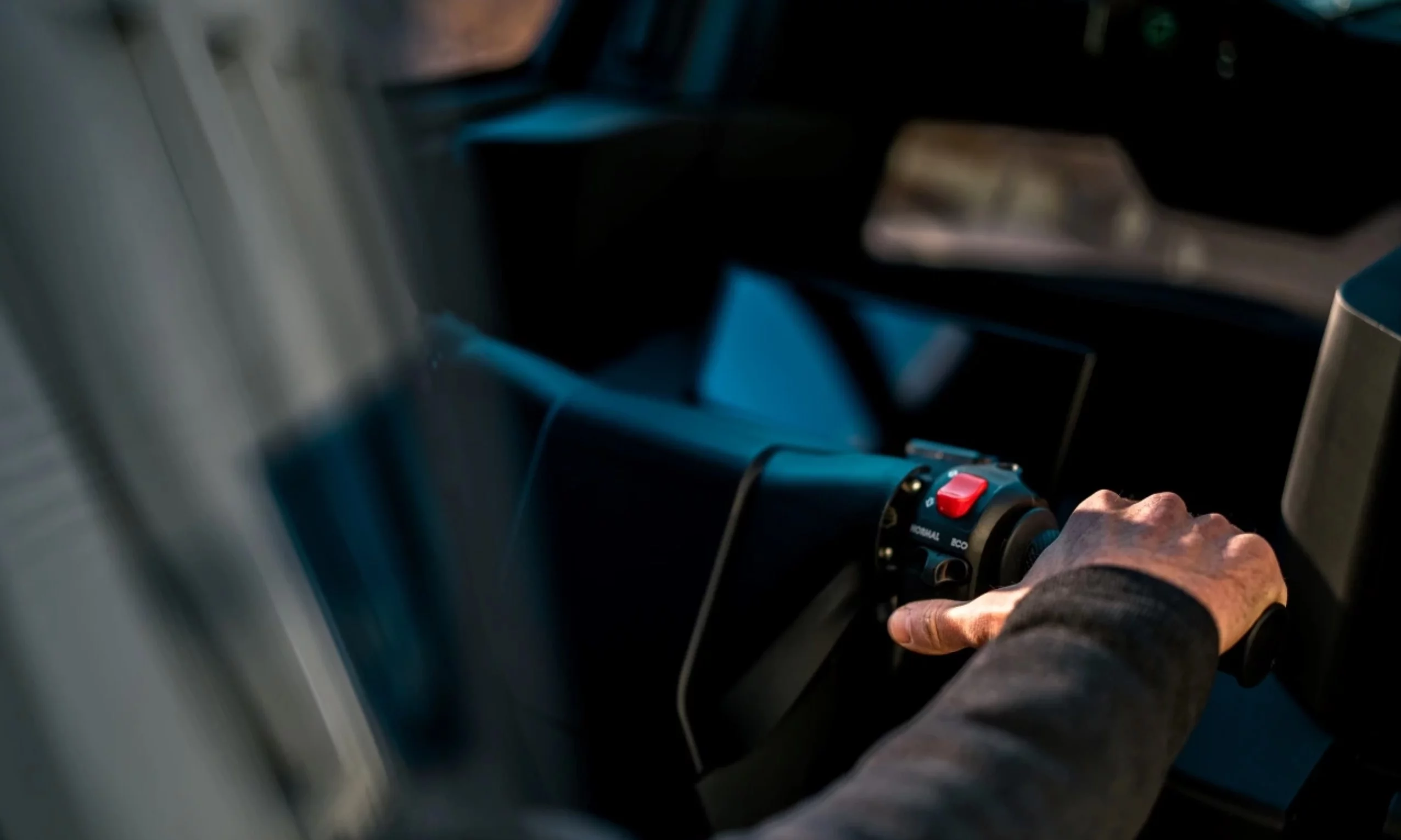 The AEMotion tilting electric vehicle is controlled using a moto-like handlebar