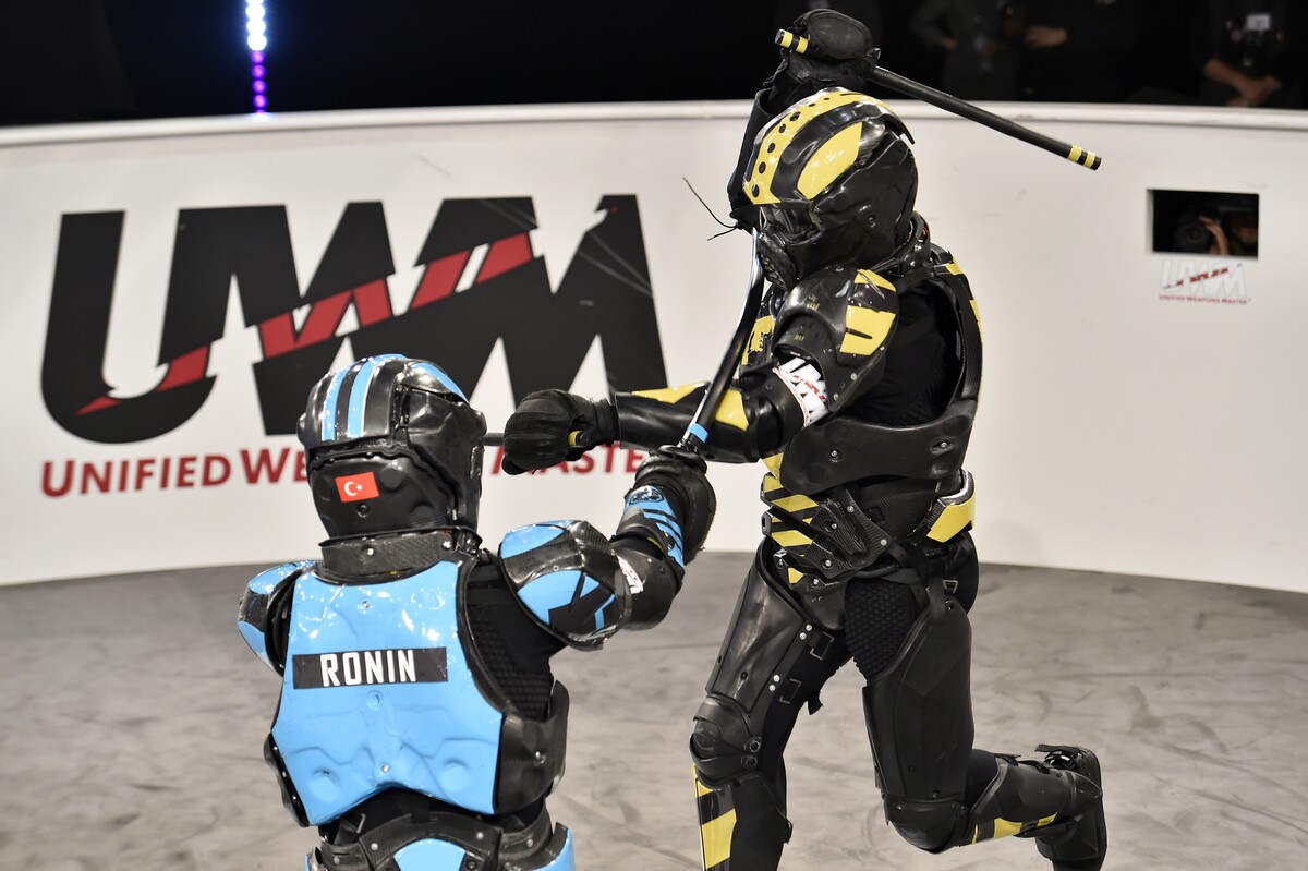 Ronin (L) takes on The Wolf in multi-weapon combat