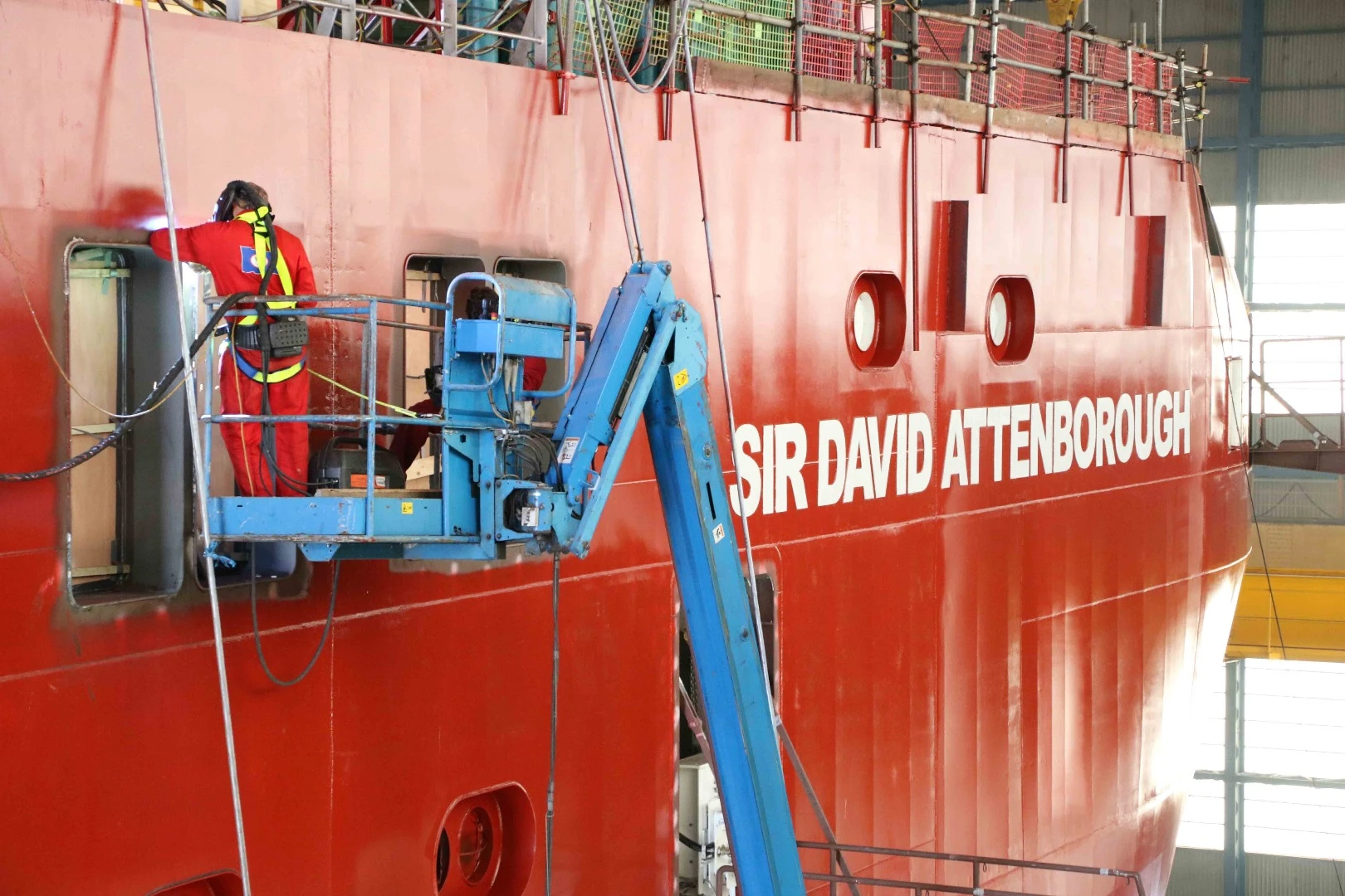 Painting the name on Royal Research Ship (RRS)
