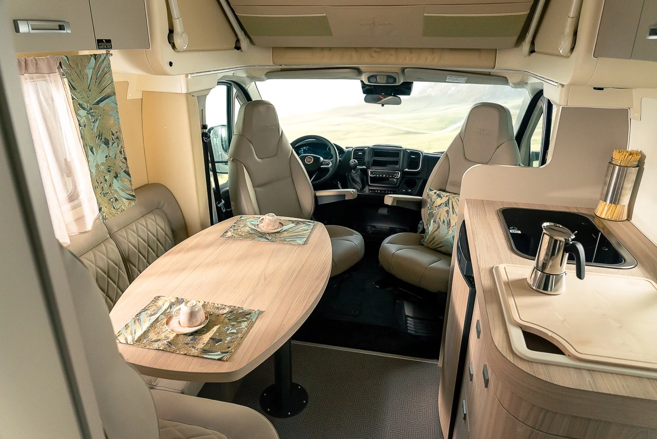 The lounge seats five during the day, then makes way for the drop-down overhead bed at night