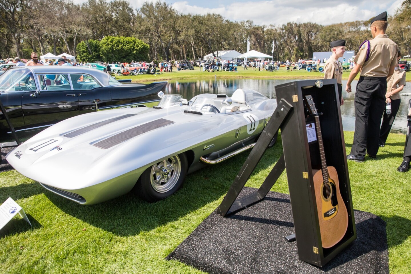In 1958, GM design chief Bill Mitchell wanted to build a Corvette racecar capable of beating Europe's best. With the availability of Zora Arkus-Duntov's defunct 1957 SS test mule chassis, Mitchell's XP-87 was underway. Mitchell's project had to be privately financed. GM insisted that Mitchell's design have no recognizable association with the Chevy brand or Corvette name so the XP-87 name was dropped and changed to Stingray. Completed in 1959, Mitchell's Stingray was fitted with a high-compression, fuel injected 283 c.i. V-8 engine producing 315 hp and entered into SCCA C-Class competition. At the end of the 1960 season, Mitchell retired the Stingray from competition, converted it for street use and exhibited it as an experimental show car. The concept was subsequently used in the 1967 film "Clambake", where it was driven by Elvis Presley. The car was one of the stars of the show at Amelia Island