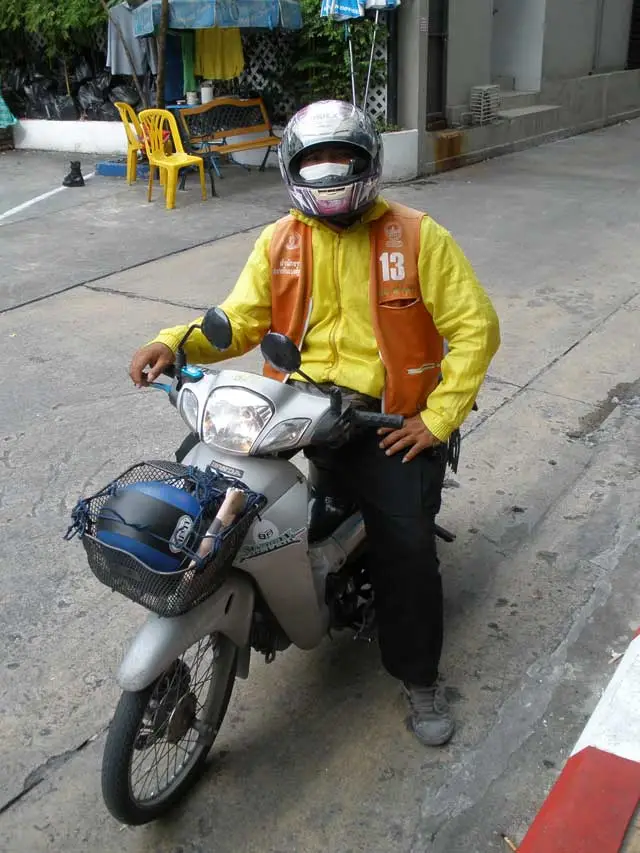 One of Bangkok's finest motorcycle taxi pilots - lok out Valentino!