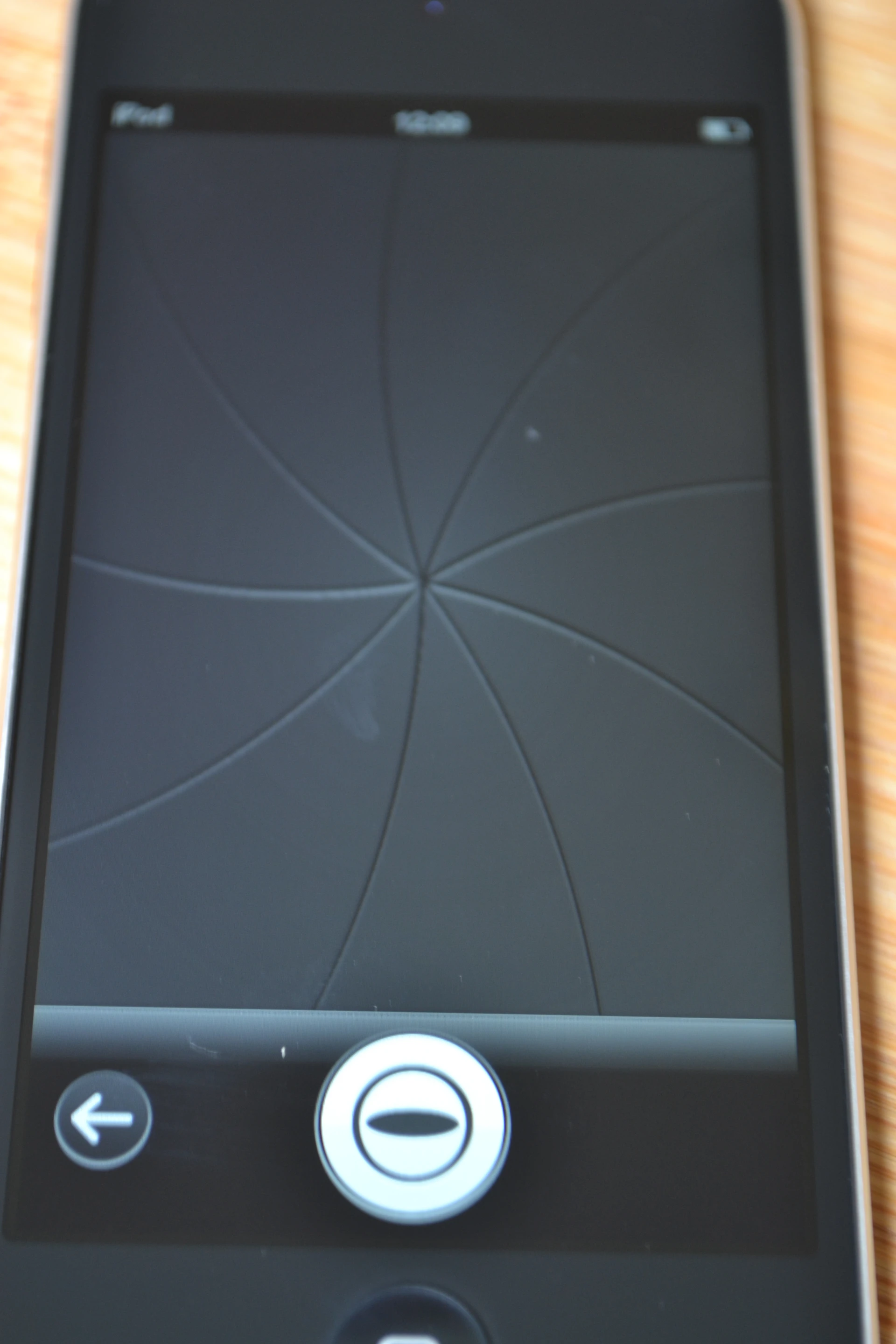 An animated shutter fires when the button icon is pressed