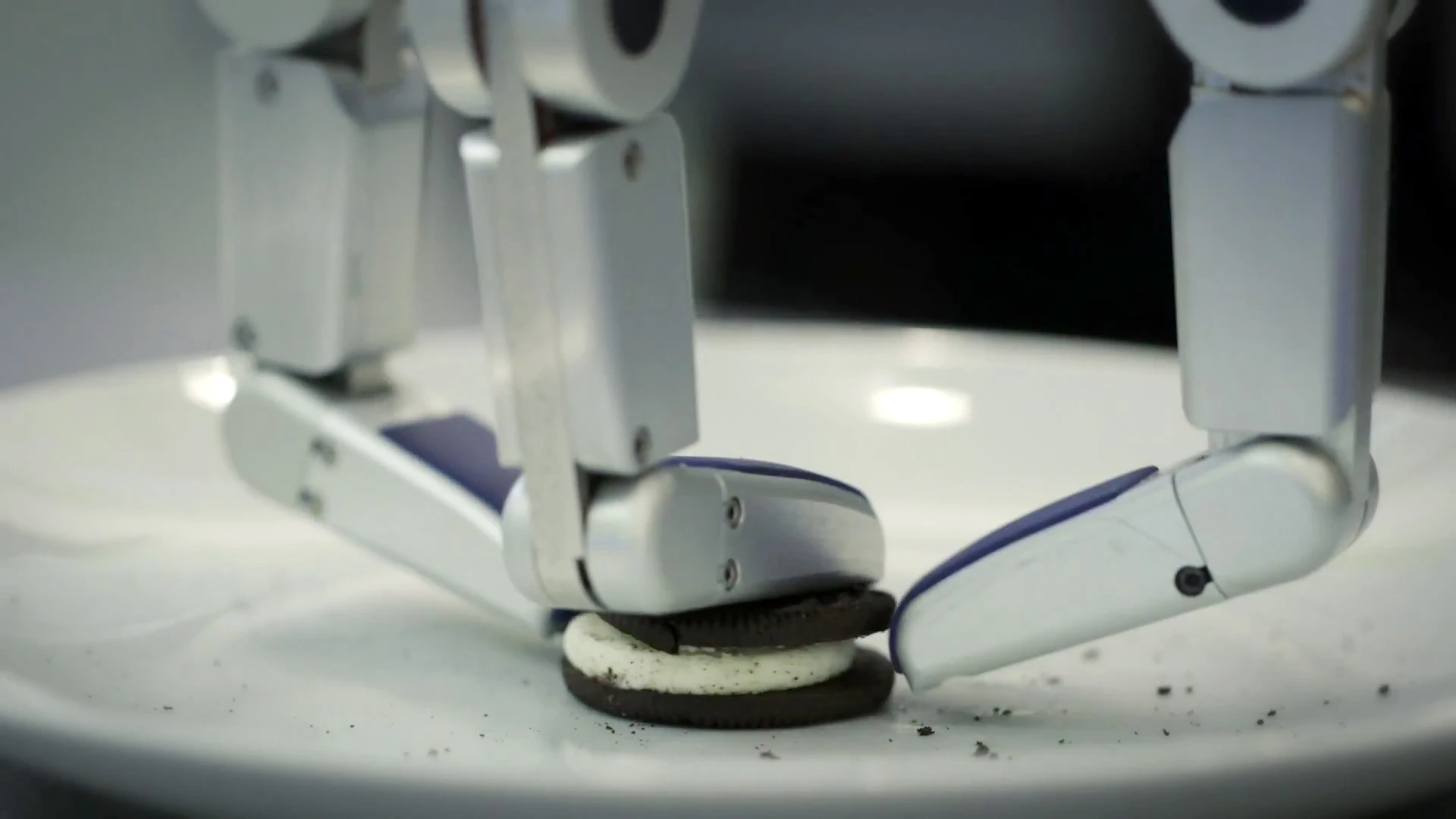 HERB has to position its hand and fingers accurately to grasp and hold the Oreo cookie