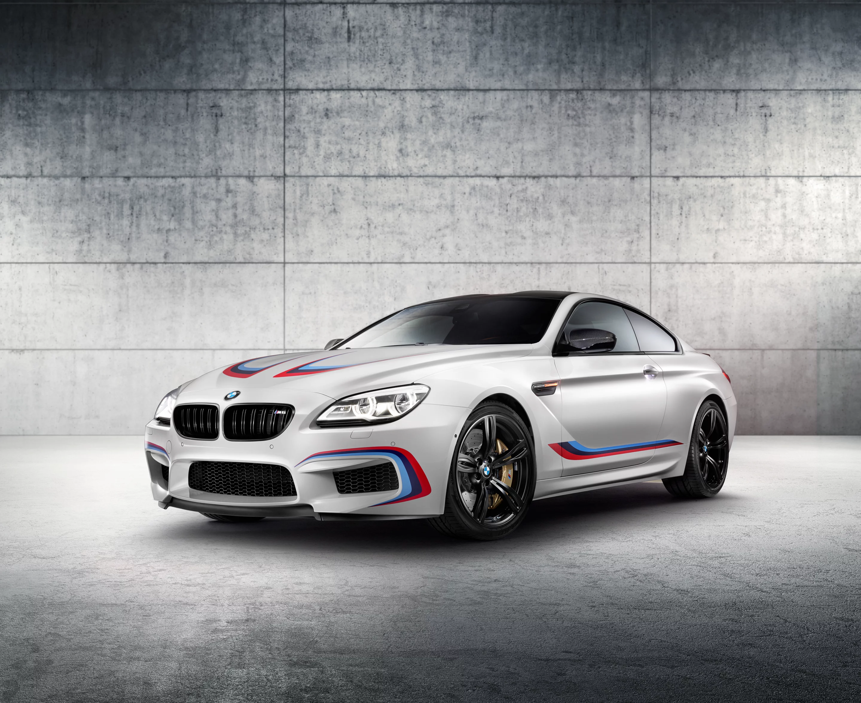 The BMW M6 Coupe Competition Edition shares its engine and bodywork stripes in the BMW M colors with the new M6 GT3