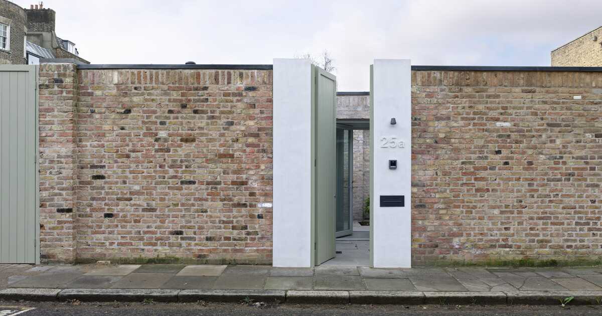 Ordinary looking garden wall conceals two-bedroom courtyard home