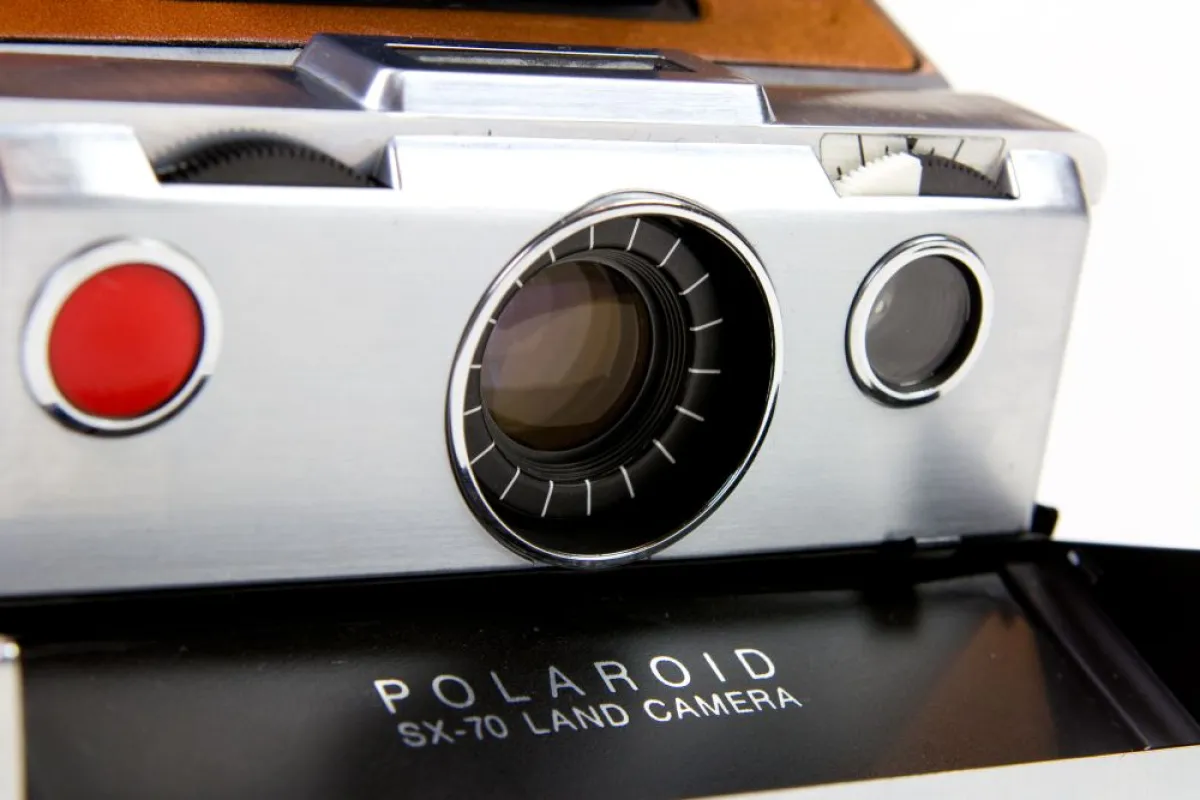 The camera is equipped with a 116mm f/8 lens, f8 to f22 aperture lens, featuring manual focus of 10" to infinity
