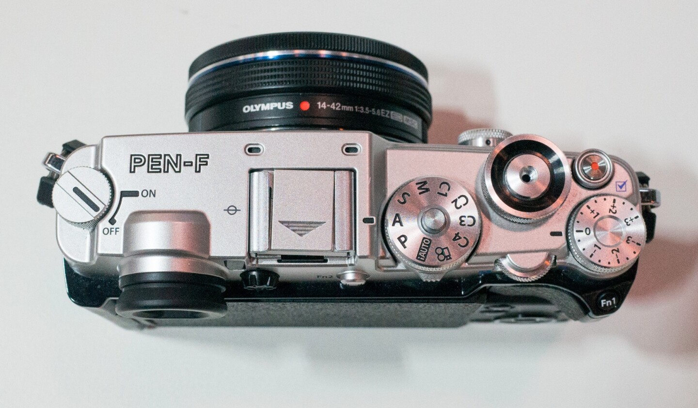 The top dial of the Olympus PEN-F now features access to custom settings
