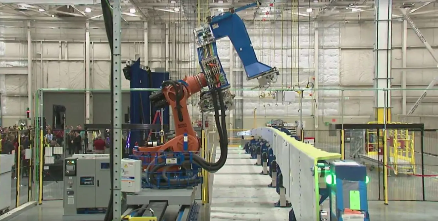 A robot began drilling the composite spar for the 777X