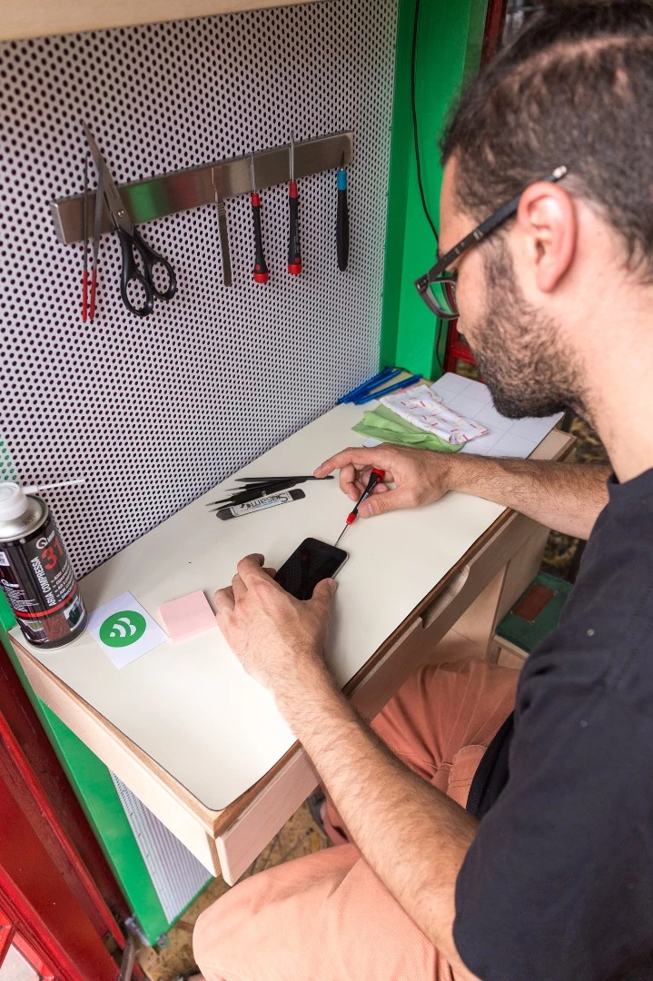 A perforated back panel provides a place on which to hang tools and behind which to run wiring and communications devices