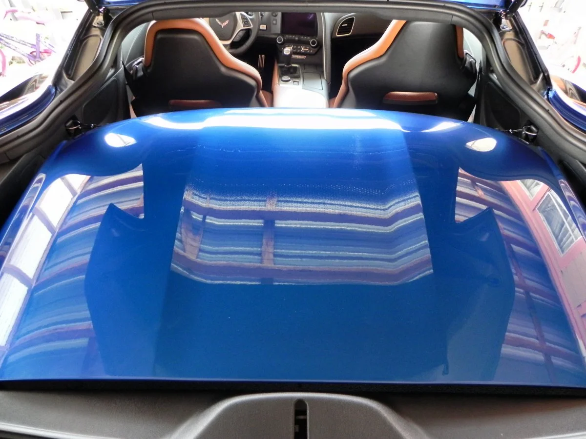 The lightweight carbon fiber top removes easily and stores in built-in clips in the rear hatch of the Coupe model