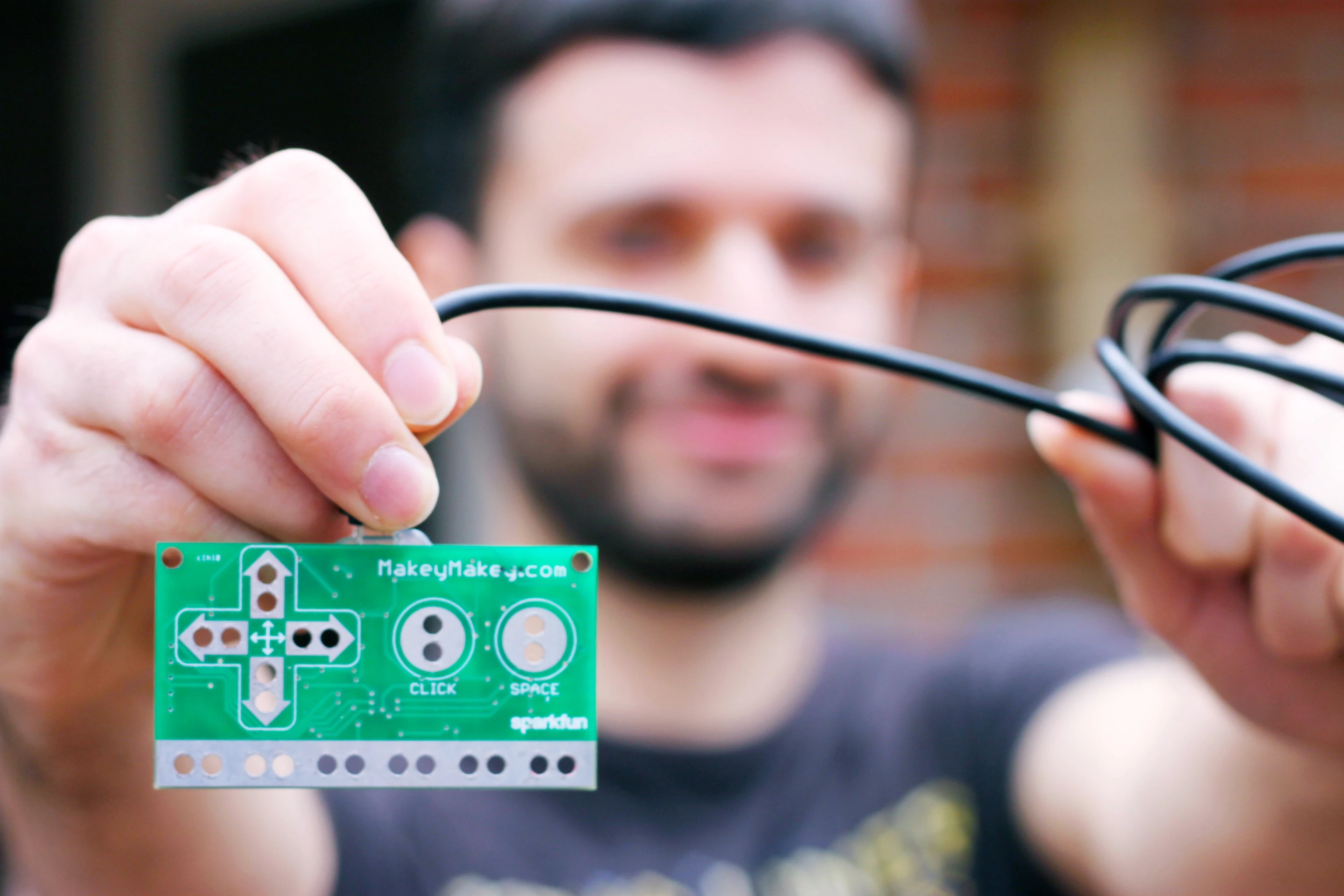 The Makey Makey board is connected to and powered by a computer via USB