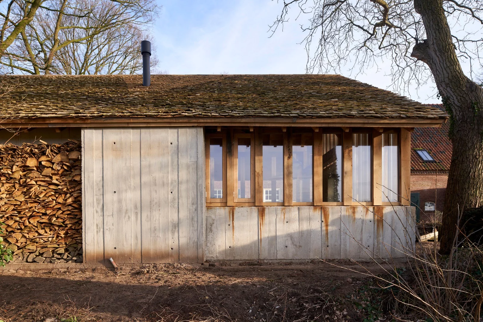 Deteriorating, century-old oak trees destined for the scrapheap have been and worked into a lovely barn in the Netherlands