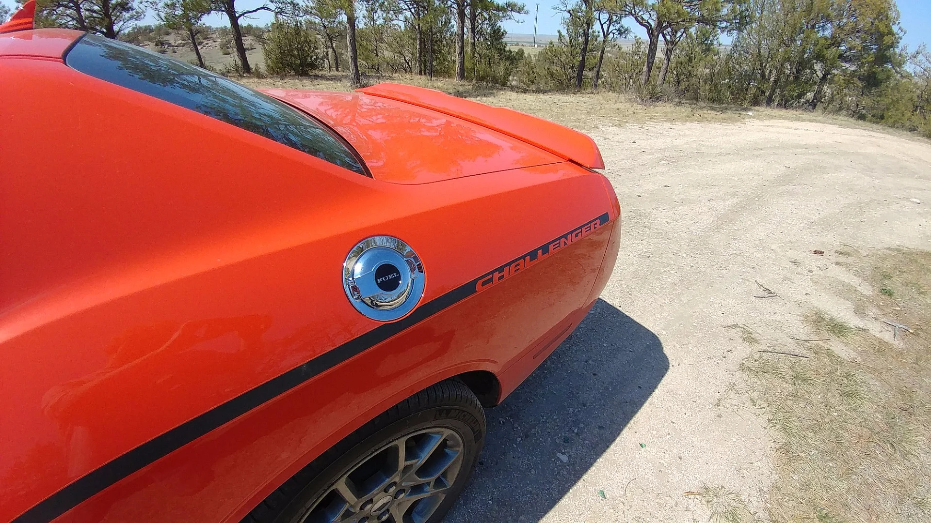 Touches included in the GT package include this race-style filler cover and striping