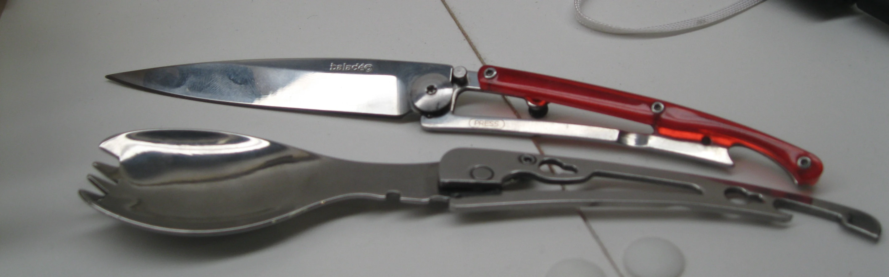 Fold and split the package into a spork and knife