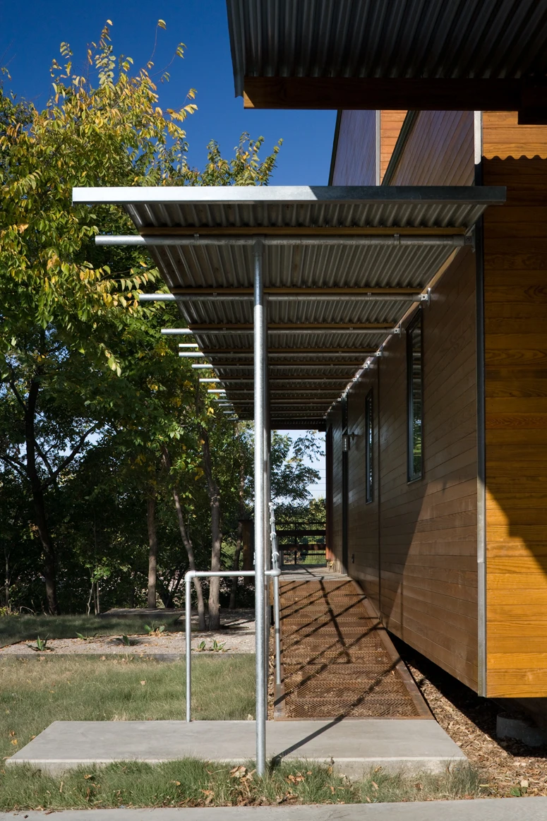 A gangplank-like metal ramp provides access to the home (Photo: Charles Davis Smith)
