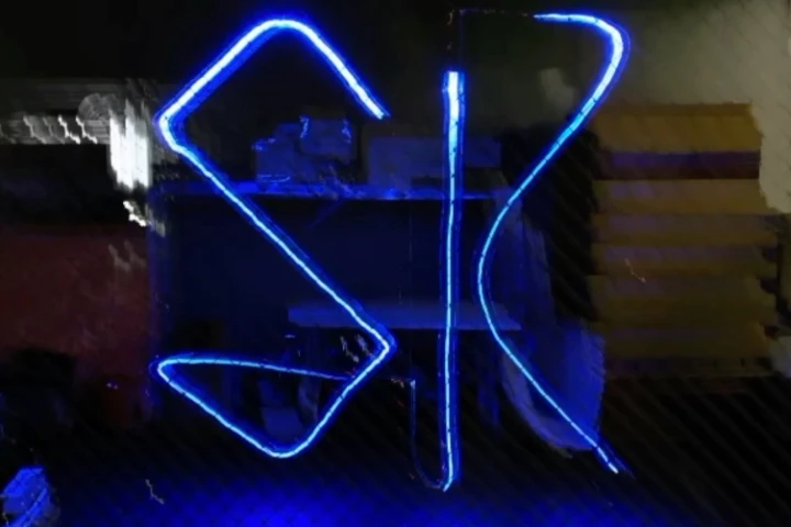 A timed exposure of a DroneLight-using quadcopter writing the letters S and K in the air