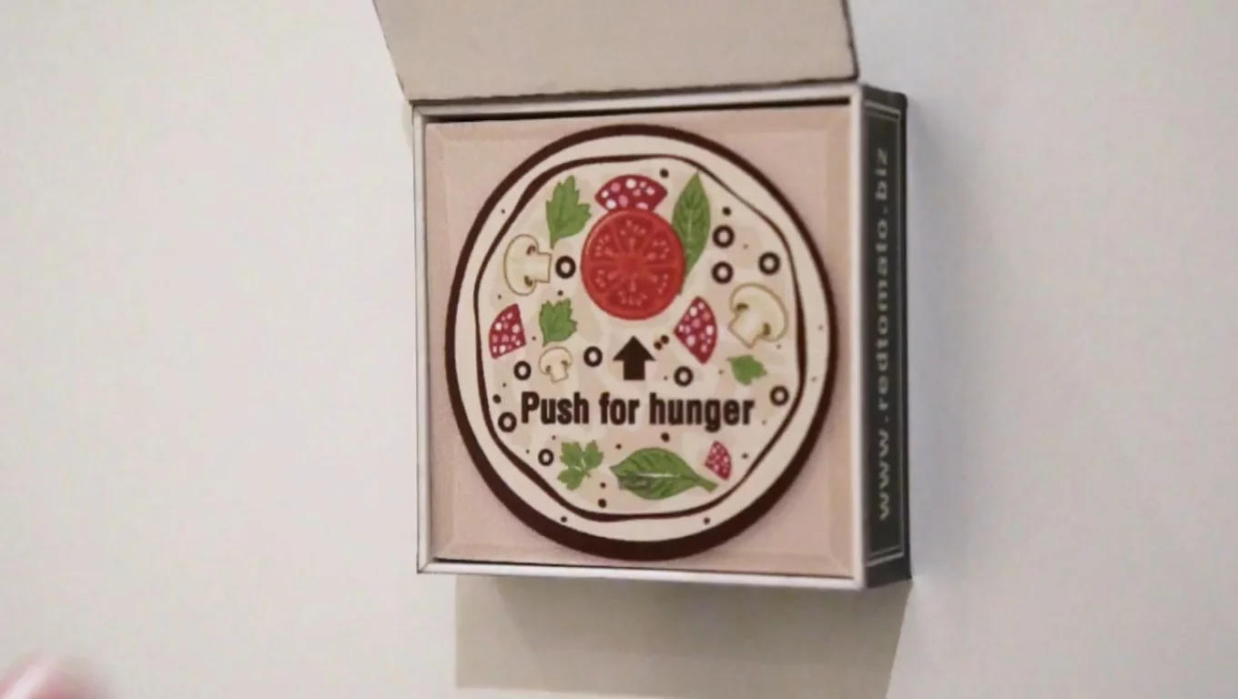 A Dubai-based pizza shop is offering refrigerator magnets to customers that automatically orders their favorite pizza over the Internet when the button on it is pressed