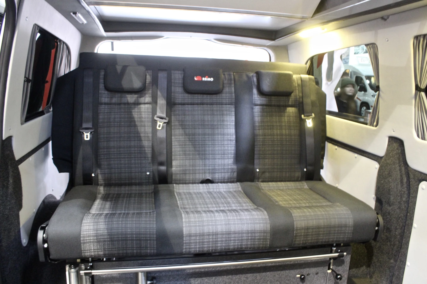 The rear bench seats three during driving and sleeps two when folded out into a bed