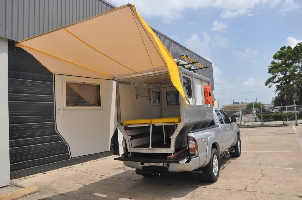 Inside, the Firefly sleeps two or hauls two dirt bikes