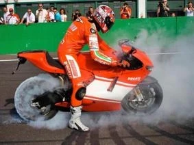 Vittoriano Guareschi taking the wraps (and some rubber) off the Desmosedici RR