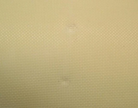 The front of Kevlar fabric soaked in STF after being shot with bullets