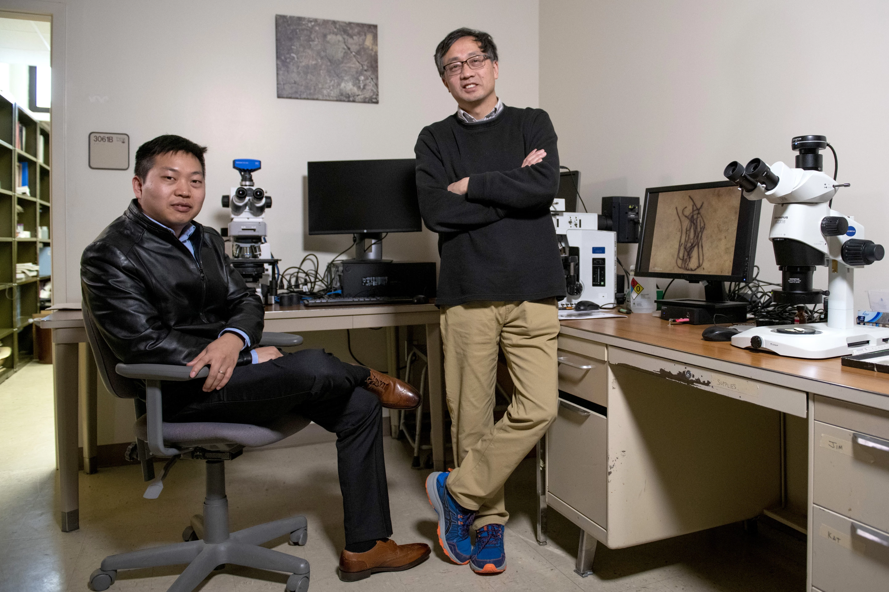 Geobiology professor, Shuhai Xiao, right, poses for a portrait with his postdoctorate Qing Tang in Derring Hall