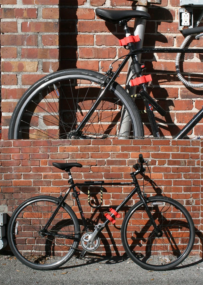 When not in use, the Bag Buddy can simply be clamped to the bicycle frame
