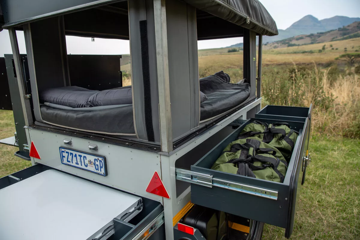 The side drawers, which will be enclosed by the annex tent, can hold clothes, bags and other supplies