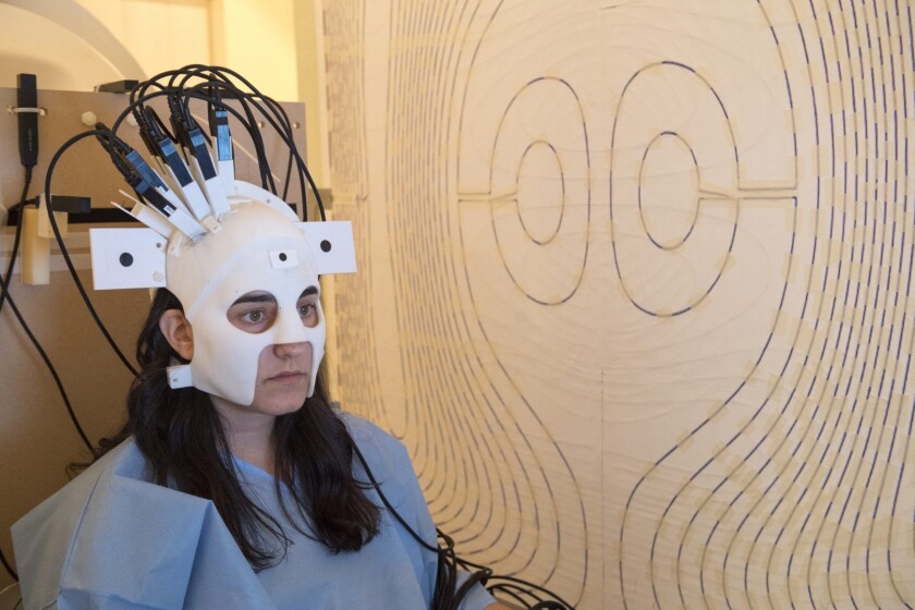 A Nottingham team has developed a wearable MEG helmet, which can perform brain scans on patients while they're moving their heads and performing other actions