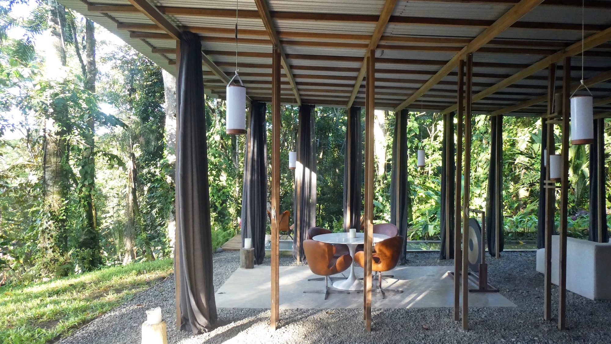 The Open Jungle House's floor is made up of gravel covering the soil beneath, as well as some concrete and wooden platforms