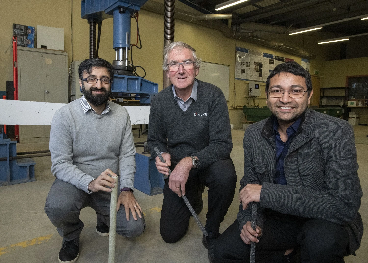 Deakin's Dr. Kazem Ghabraie, Austeng Engineering's Ross George and Deakin's Dr. Mahbube Subhani, with samples of the rebar