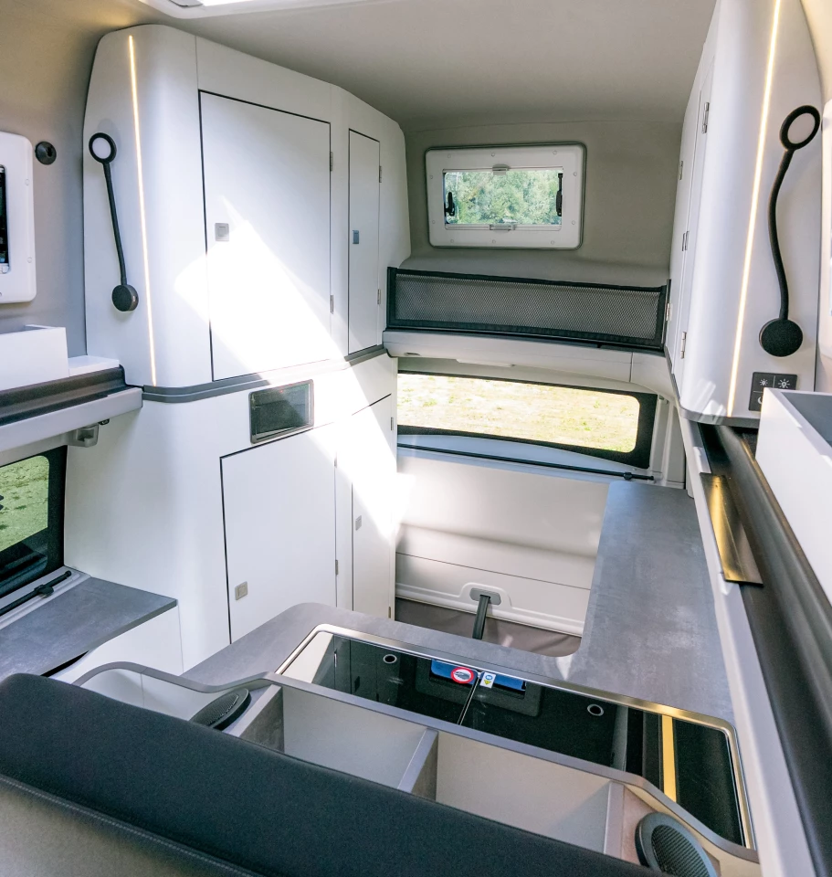 View from inside the bed - those upper cabinets help give the High Roof hundreds of extra liters of storage versus the long-wheelbase pop-up model