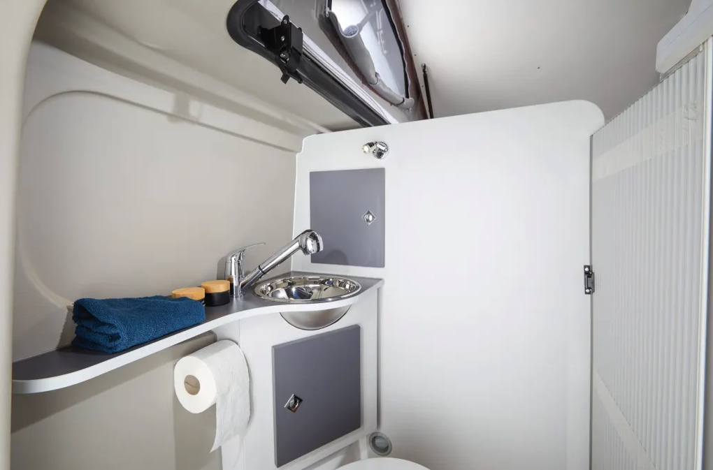 The wall's a bit short due to the pop-up roof, but the Van Big City bathroom is a little more of a private, dedicated space than some other bathrooms in similarly sized camper vans