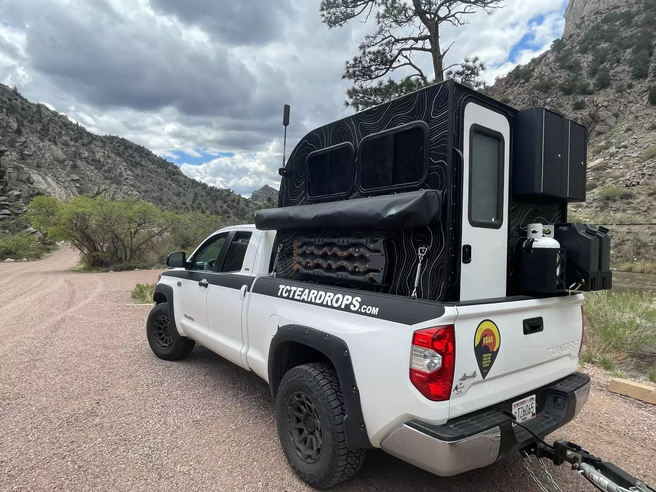With no pop-up roof, the ultra-lightweight TC Truck Camper is ready to roll after closing the door and flipping the truck's tailgate