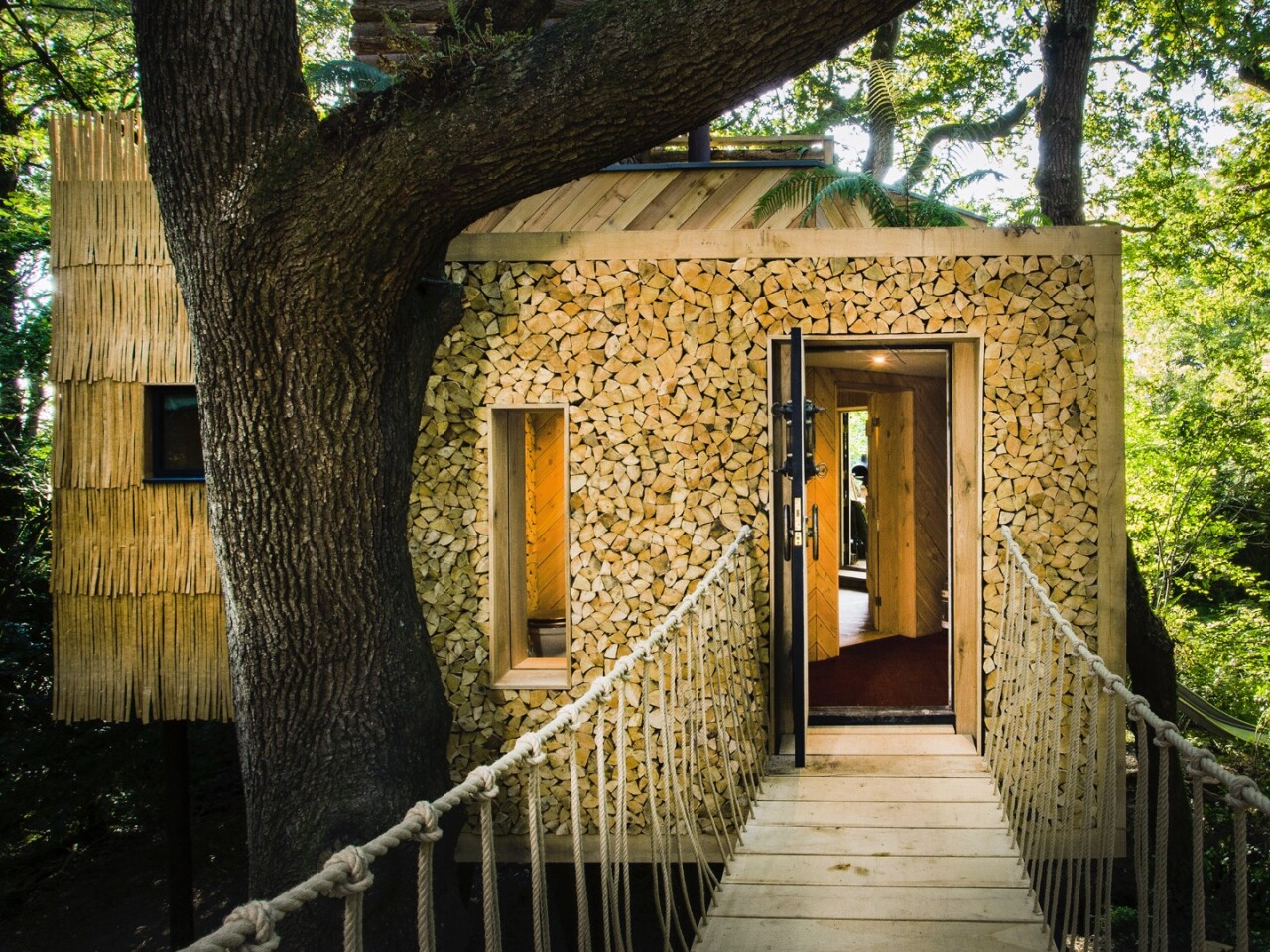 Woodsman's Treehouse is accessed by suspension bridge