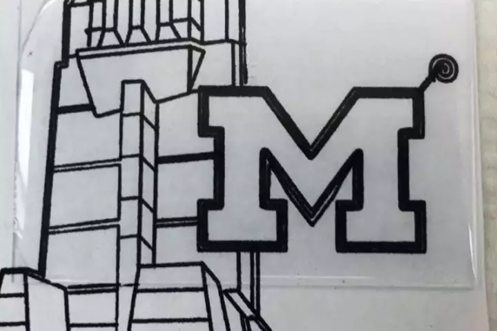 Seen here applied over a University of Michigan logo, the coating is completely transparent