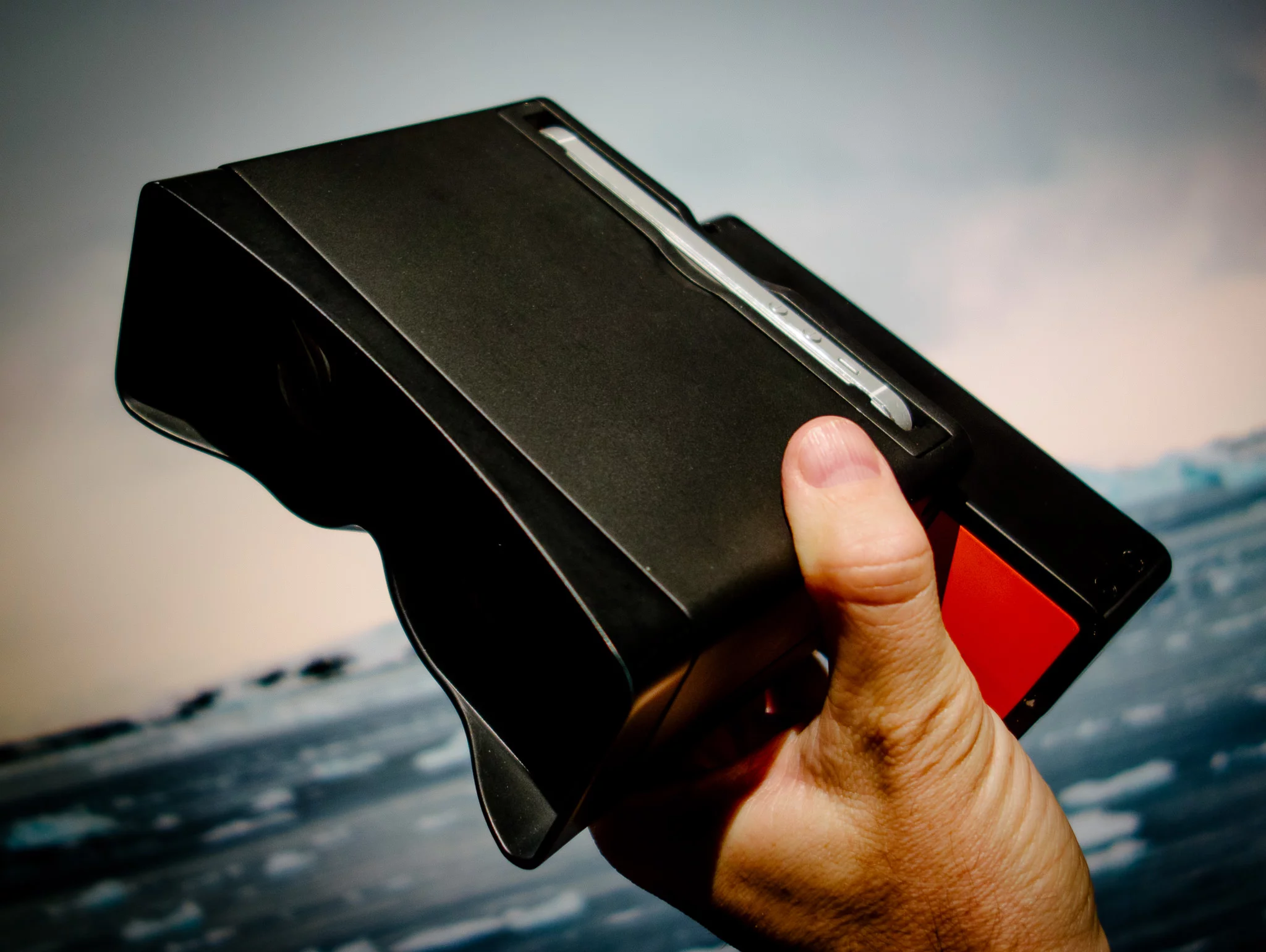 An iPhone slots into position in front of the Poppy's viewer