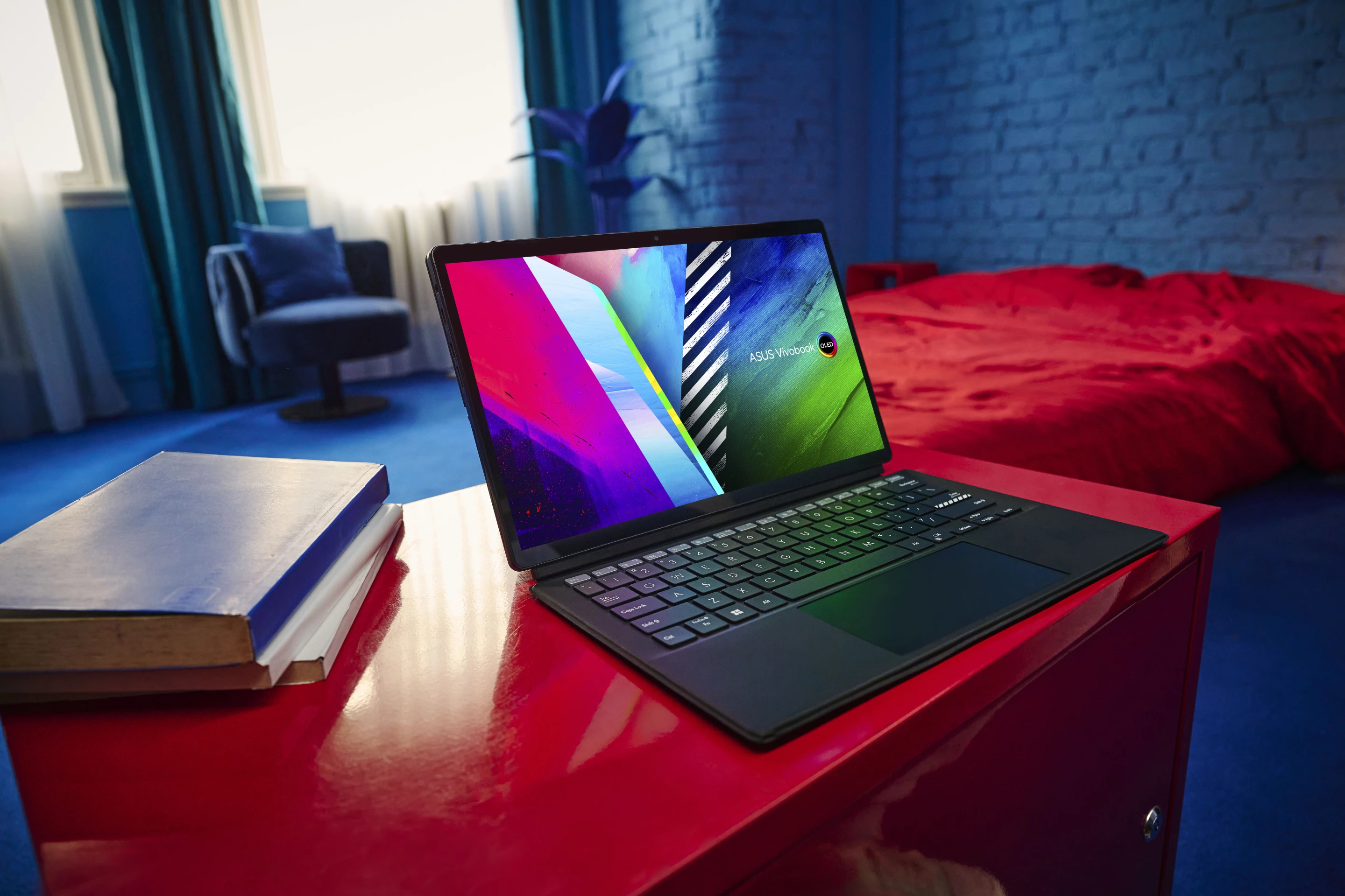 The full-size keyboard can be attached to the OLED slate for laptop-style working, the screen can be set up to watch movies or angled on the stand for artistic creativity using the stylus