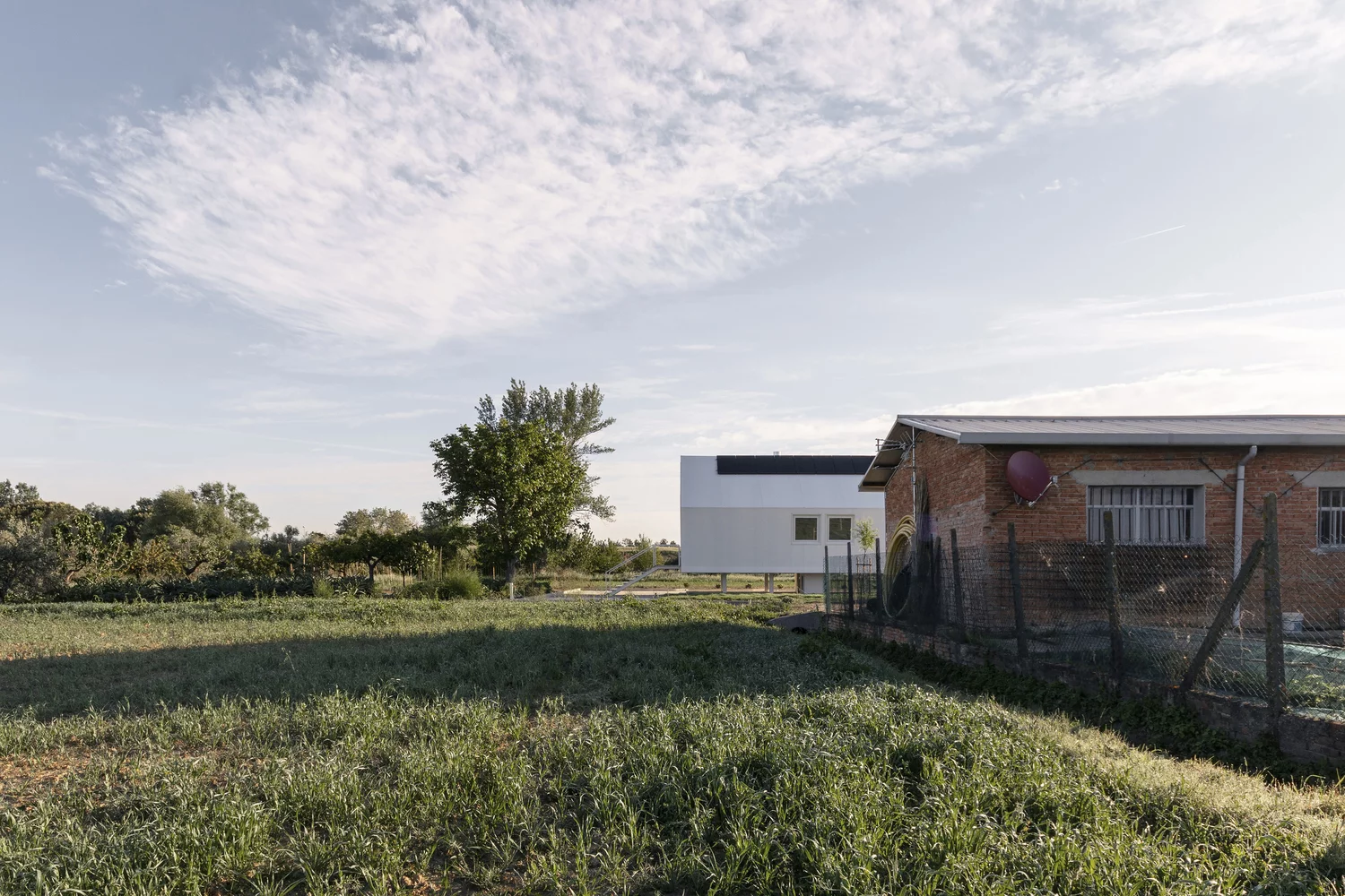 Casa Nell'Orto, meaning “House in the Orchard,” was designed to sit within a large pre-existing vegetable garden setting