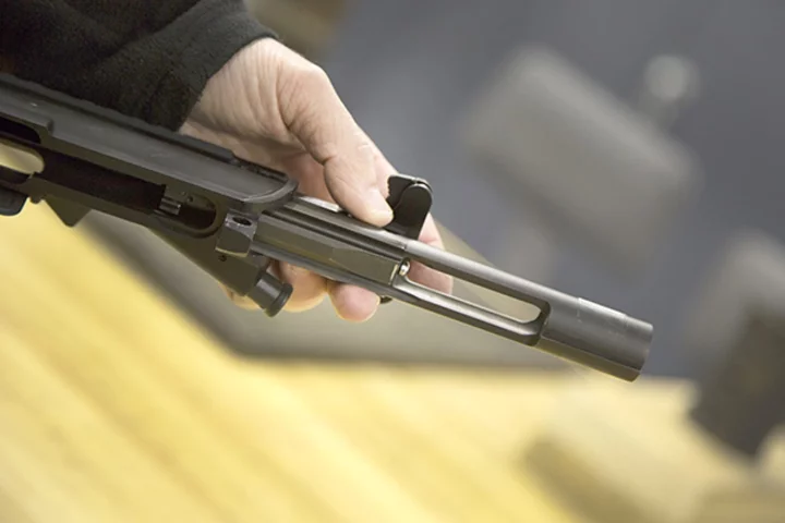 Covered with a durable solid lubricant, the bolt and bolt carrier assembly are inserted into a weapon’s upper receiver