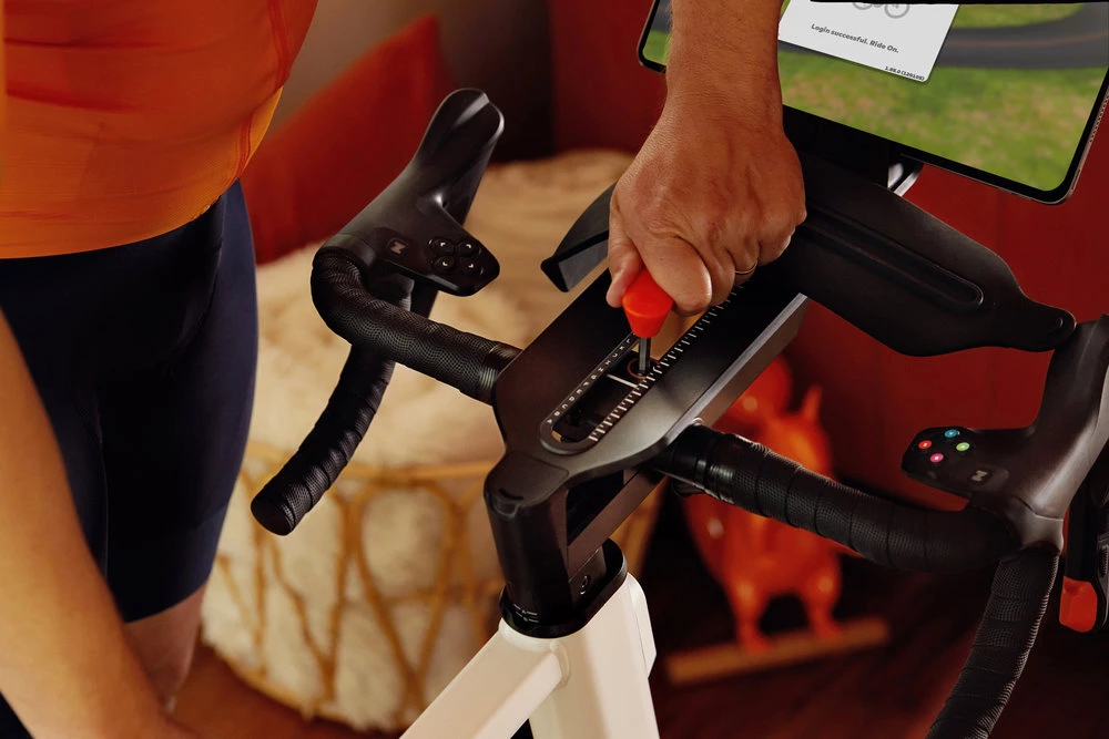 Utilizing an included Frame Key, multiple users can adjust the saddle height, bar height, and reach of a single Zwift Ride frame