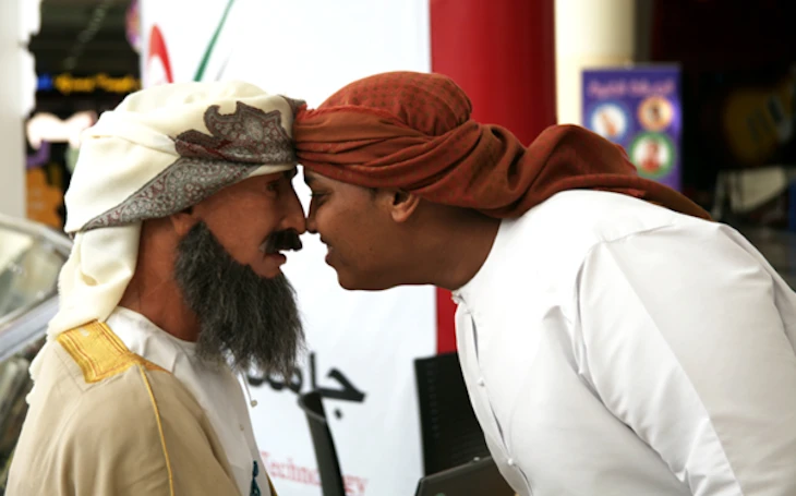An Emirati man gives Ibn Sina a traditional greeting