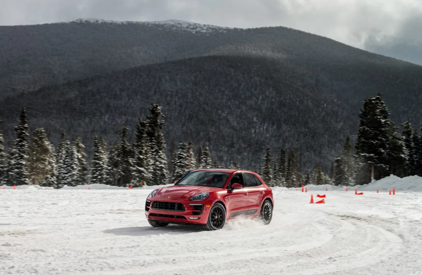 After learning the nuances of the Porsche Macan GTS on ice, we took cues from a professional race driver around the gymkhana course
