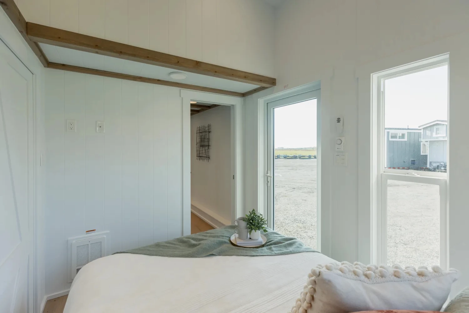 The Ventura Park Model Tiny Home's master bedroom has its own door for direct access from outside