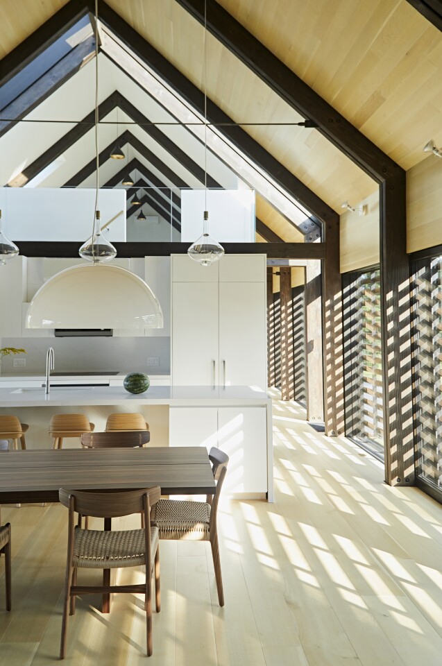 A newly finished dwelling in upstate New York takes careful cues from traditional farm buildings of the area, but makes every effort to afford it inhabitants the comfort of a modern home