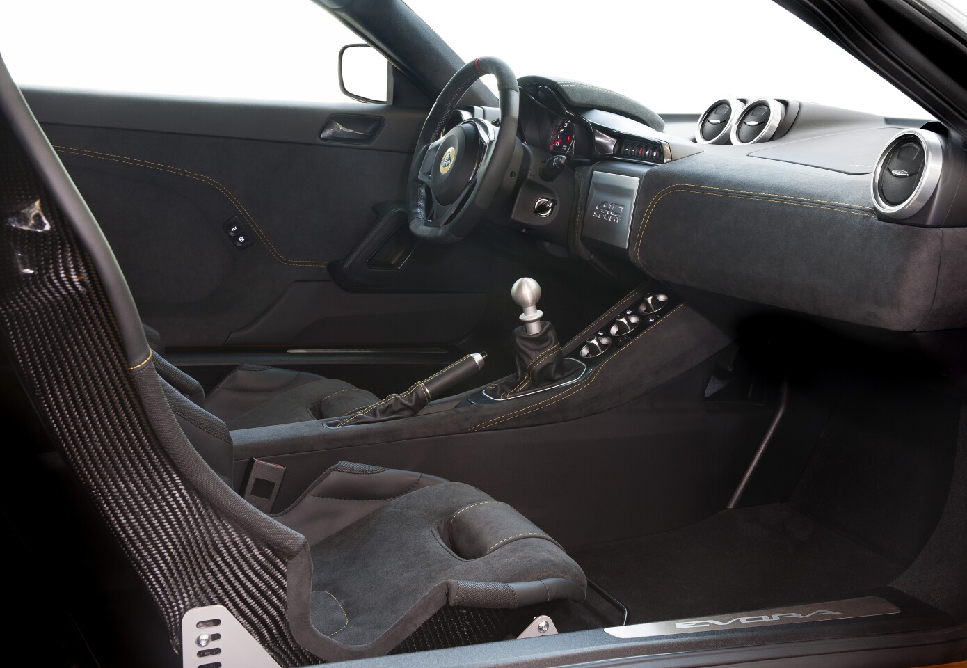 A Spartan-like interior features race-inspired sports seats, but no armrests