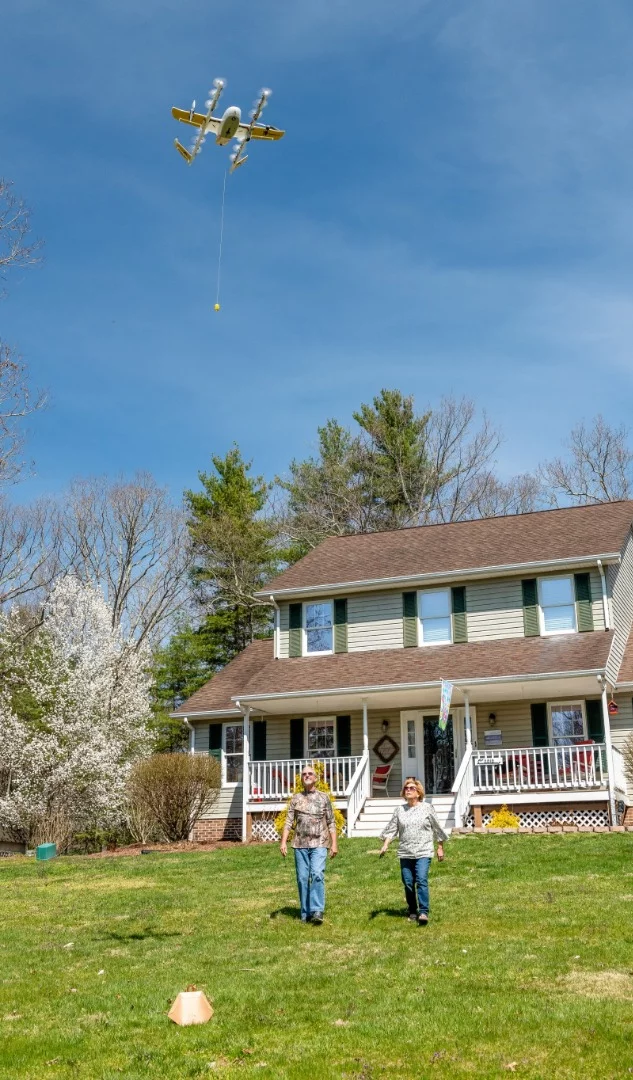 A Virginia family receives their air delivery as part of Wing’s validation testing with the FAA